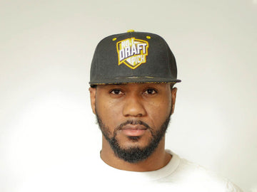Black Pittsburgh Steelers cap with embroidered team logo, curved brim, and adjustable strap for unisex NFL streetwear style
