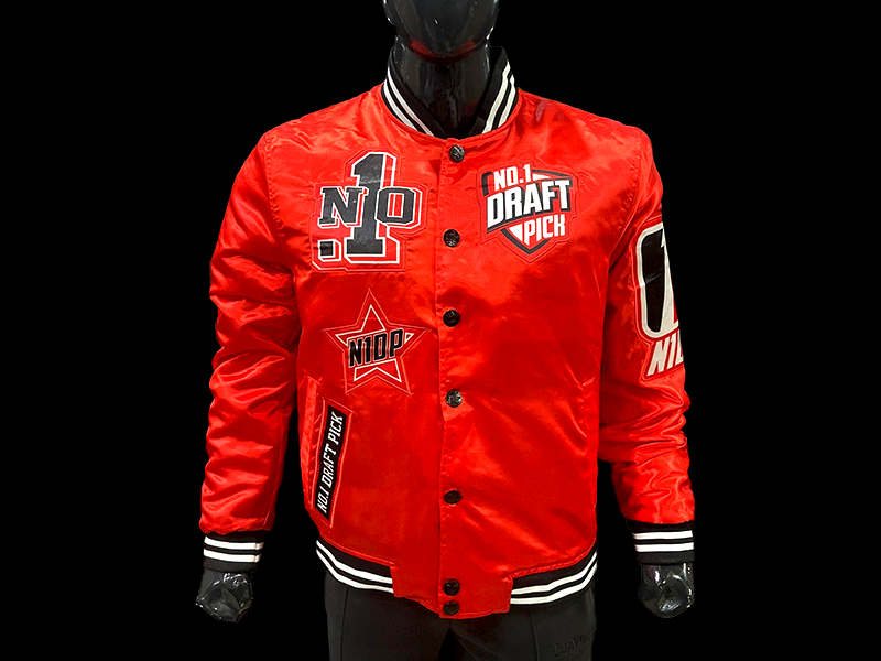 
Unisex red satin jacket featuring white “Chicago” embroidery, snap-button front, ribbed trim, and vintage streetwear style