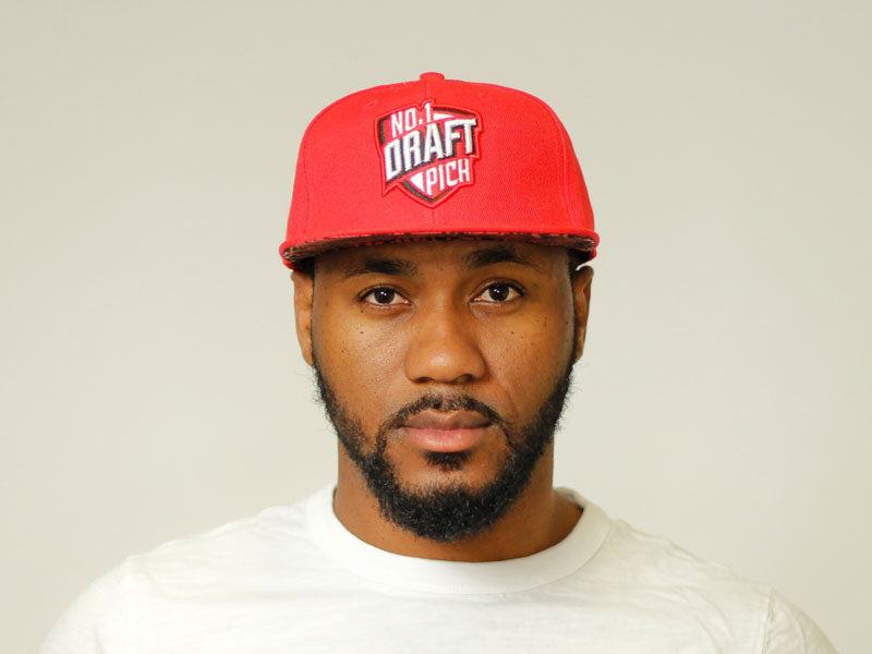Bold red Chicago cap with curved brim and embroidered front lettering, adjustable strap for unisex streetwear style
